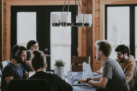 Colleagues working together at a shared table