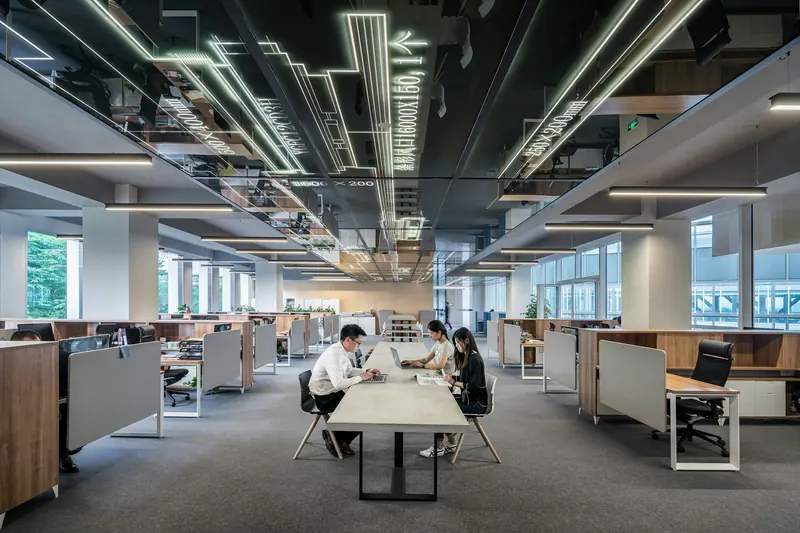 Modern open-plan office with long shared tables